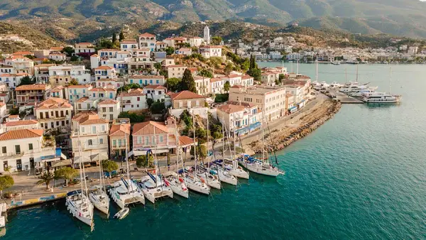 Yachts lined up on the Poros town quay