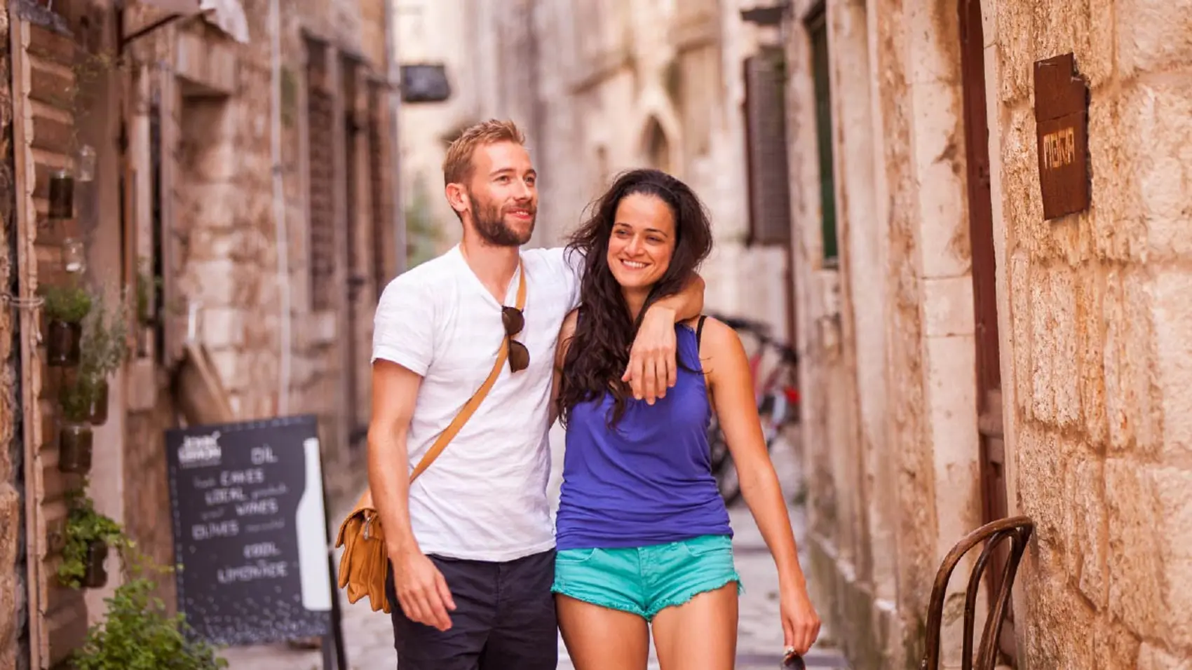 Couple walking the back streets of Trogir Old Town