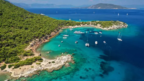 Yachts anchored in a bay on Moni Island