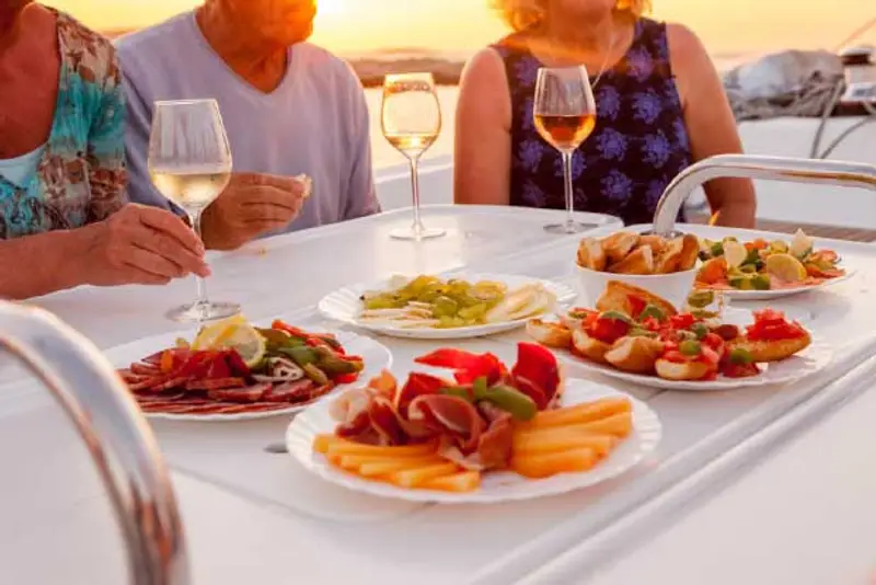 Local aperitifs at sunset on catamaran