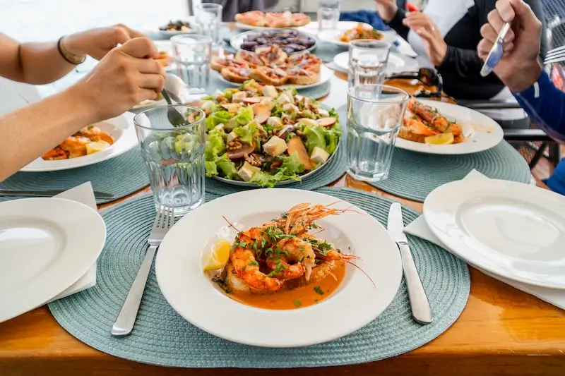 Fresh grilled shrimp with salads on a luxury catamaran cruise with yacht Getaways. 