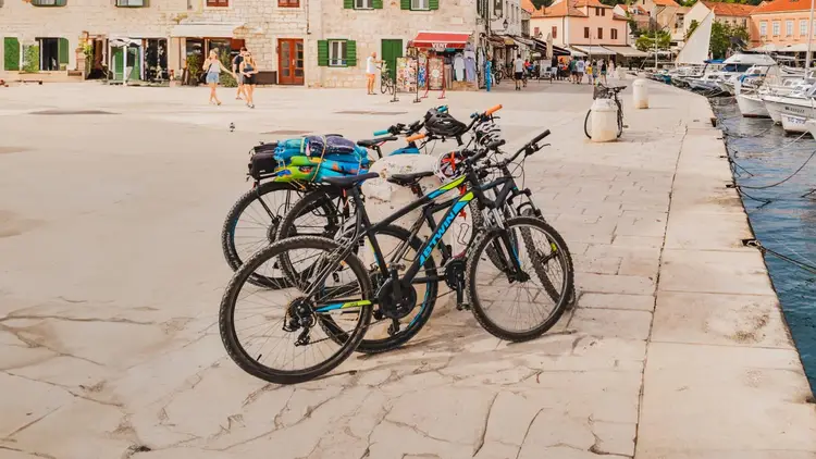 A group of bikes on the waterfront of Stari Grad Old Town in Croatia