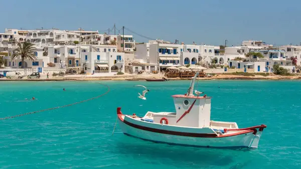 Small wooden boat in the harbour in Schinoussa