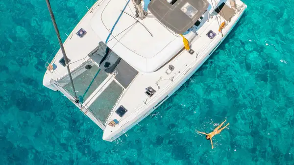 Yacht anchored in clear blue water