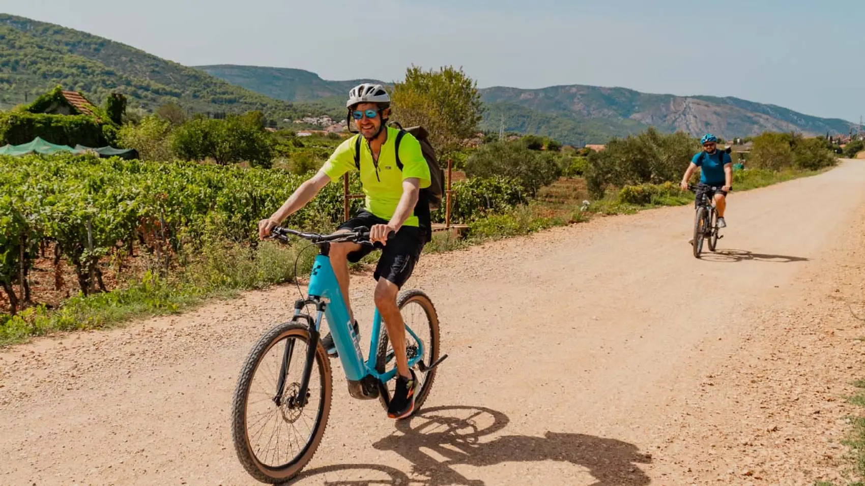 Cycling guide riding along a road in Croatia