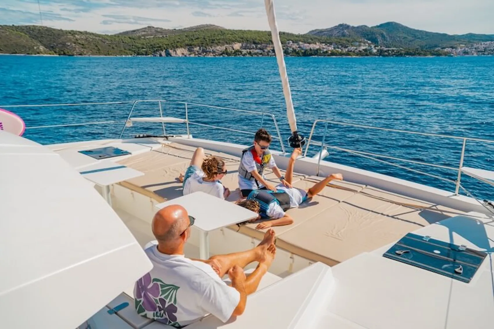 Family relaxing on a catamaran together