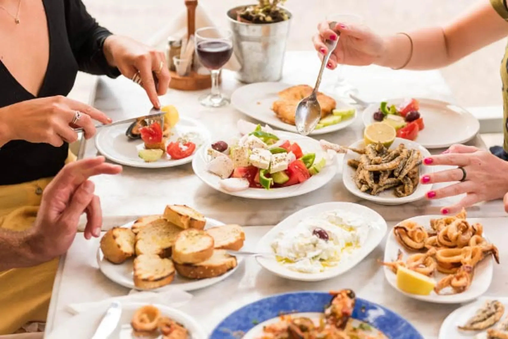 Table full of Greek food 