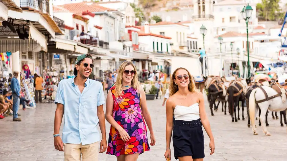 Group of friends walking Hydra town