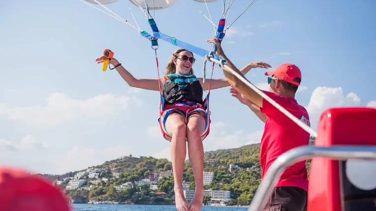 Woman parasailing in Greece