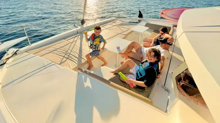 Family relaxing on a catamaran