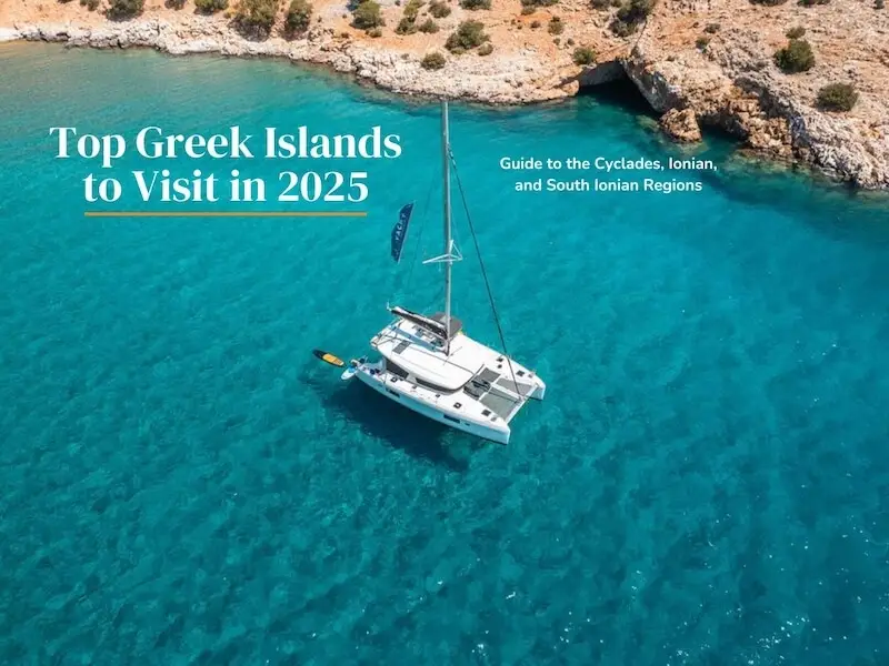 Aerial photo of a luxurious catamaran cruise anchored in a paradise bay in the Greek islands.