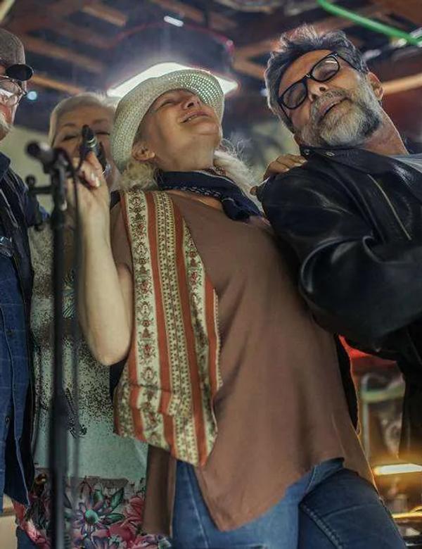 Ageing rock musicians on stage, the lead image for The Australian's column on Atomo and syphilis testing