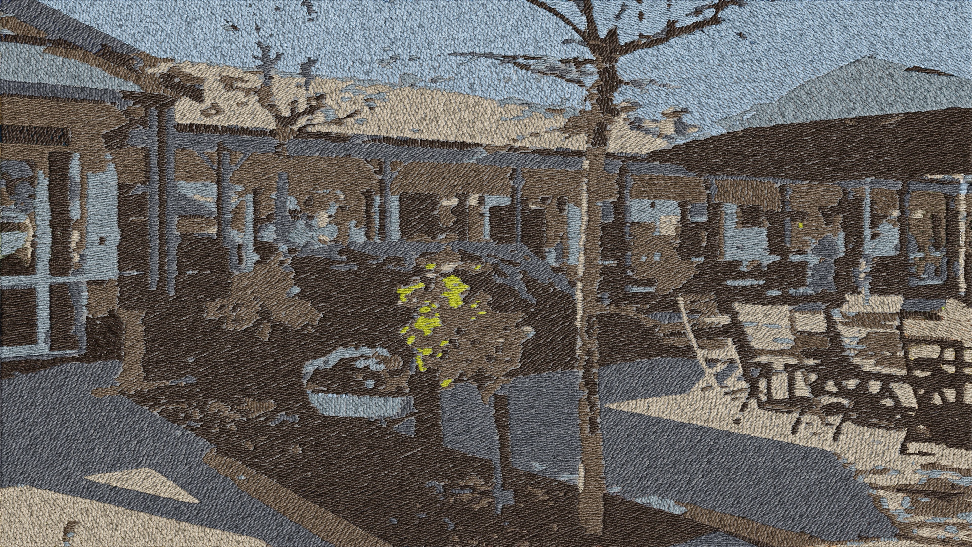 Embroidered landscape of a care home courtyard: veranda, bare tree and outdoor seating