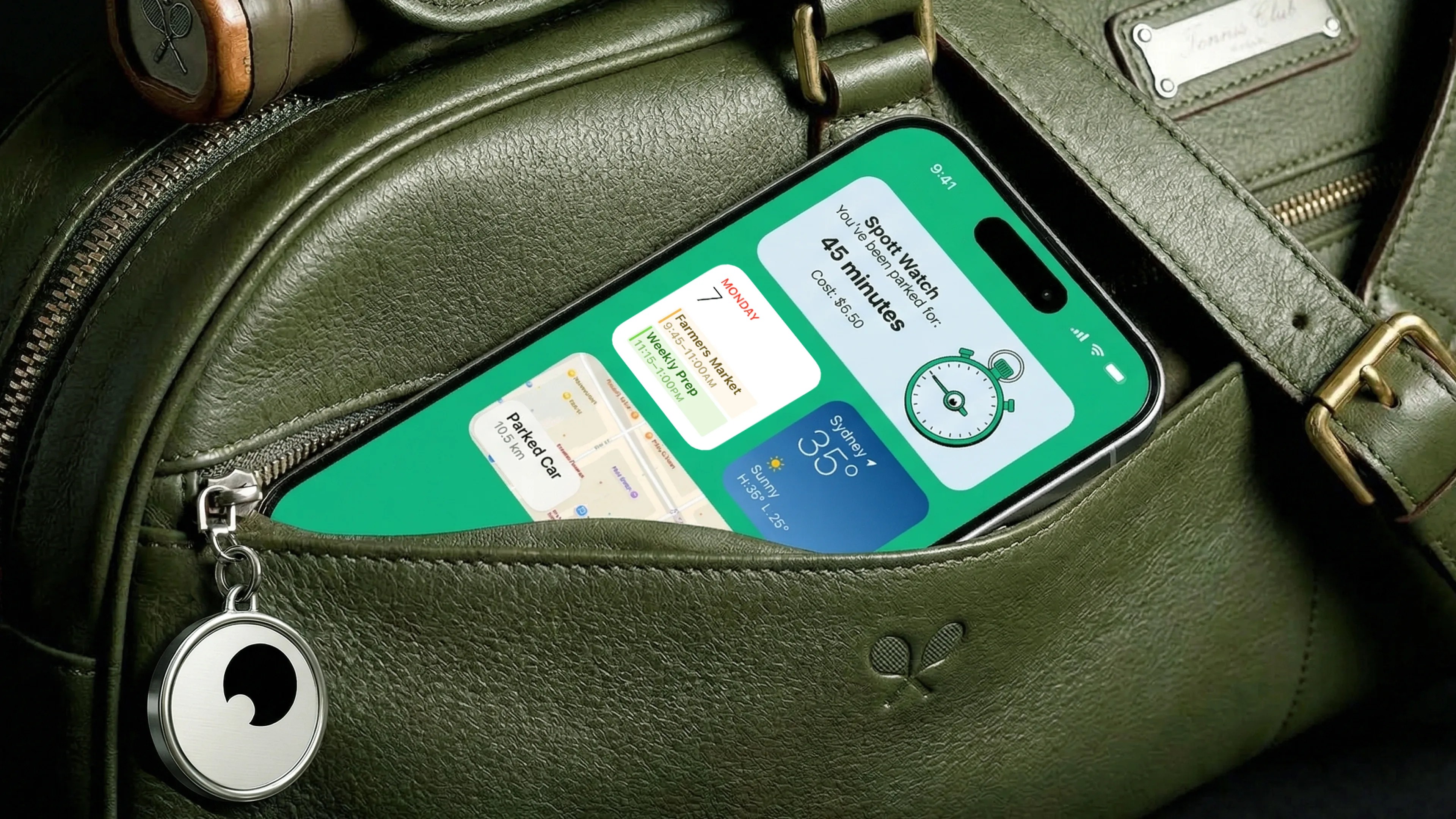 Phone in a green leather bag showing parking timer widgets, cartoon eyeball keyring on the zip