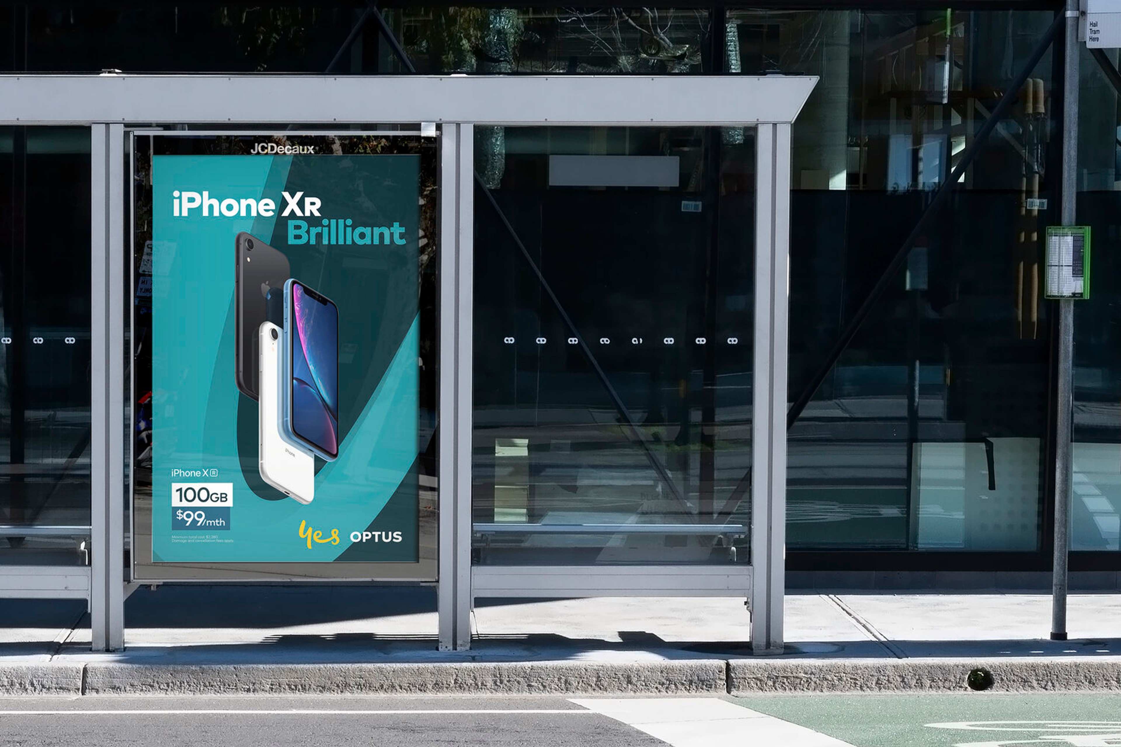 Optus bus shelter poster in teal promoting the iPhone XR, with the yellow 'yes' brand mark