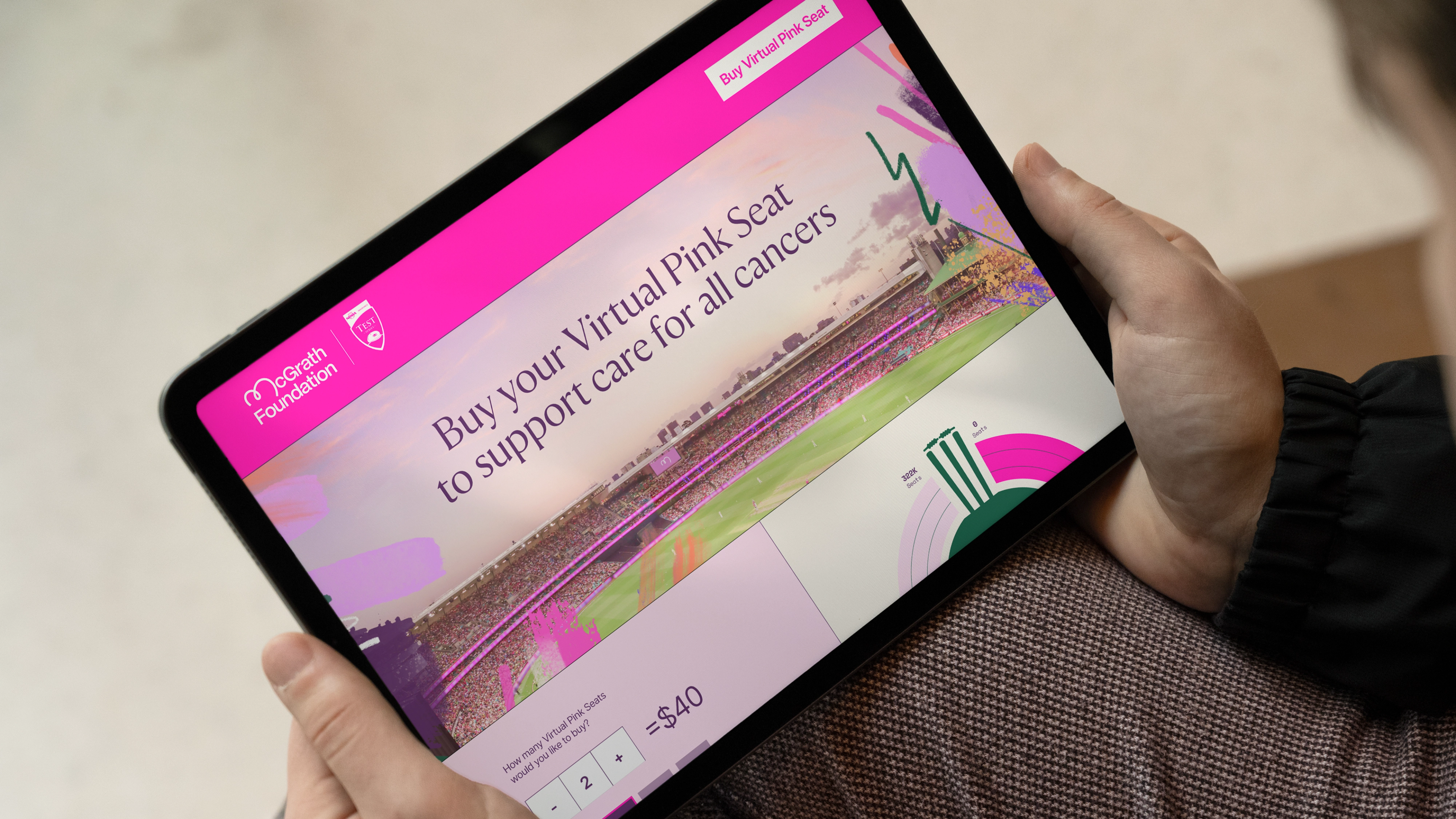 Tablet showing the Virtual Pink Seat donation page with stadium imagery under a magenta header