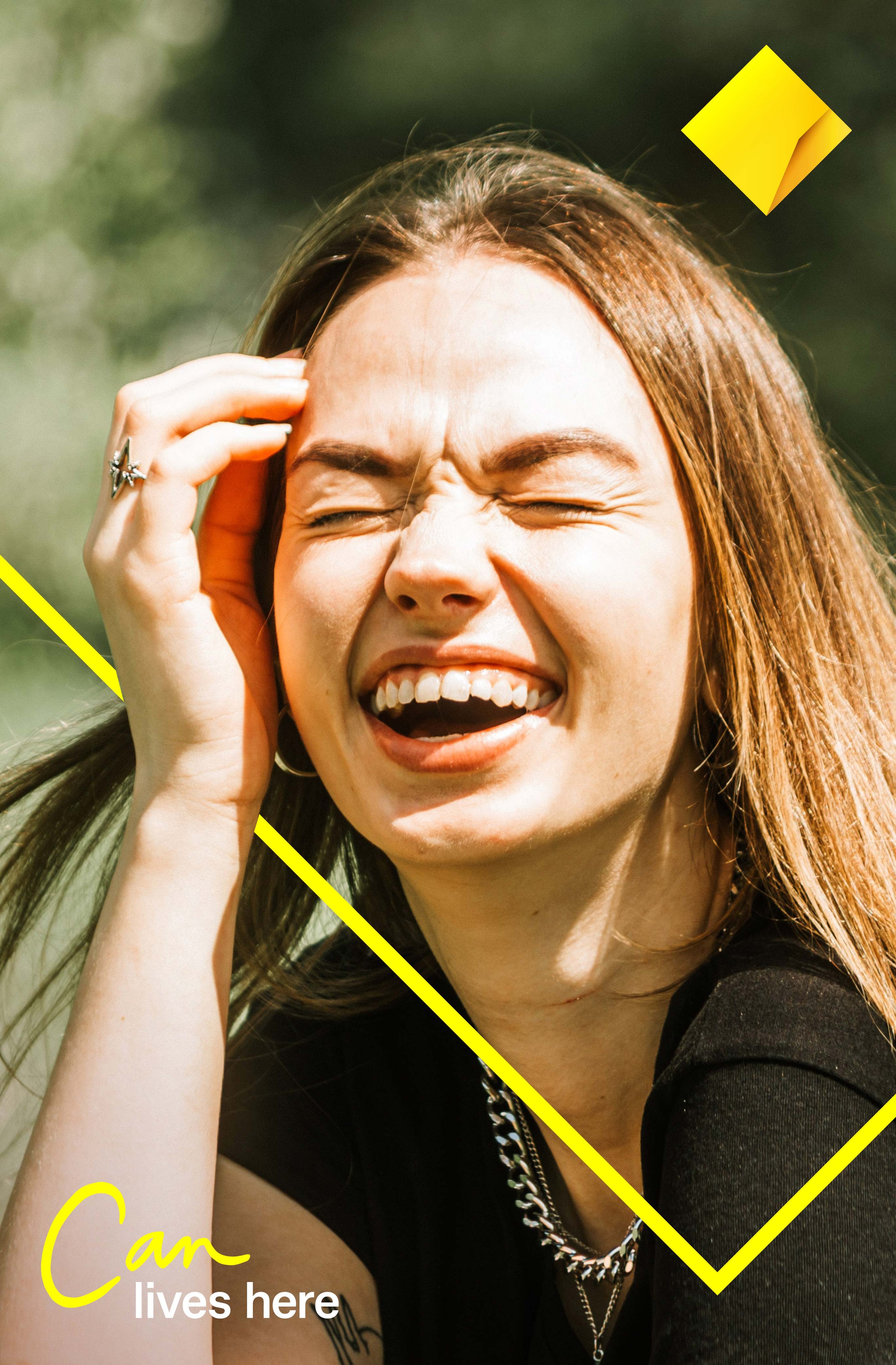 Poster of a woman laughing in sunlight, framed by yellow chevron lines and the diamond