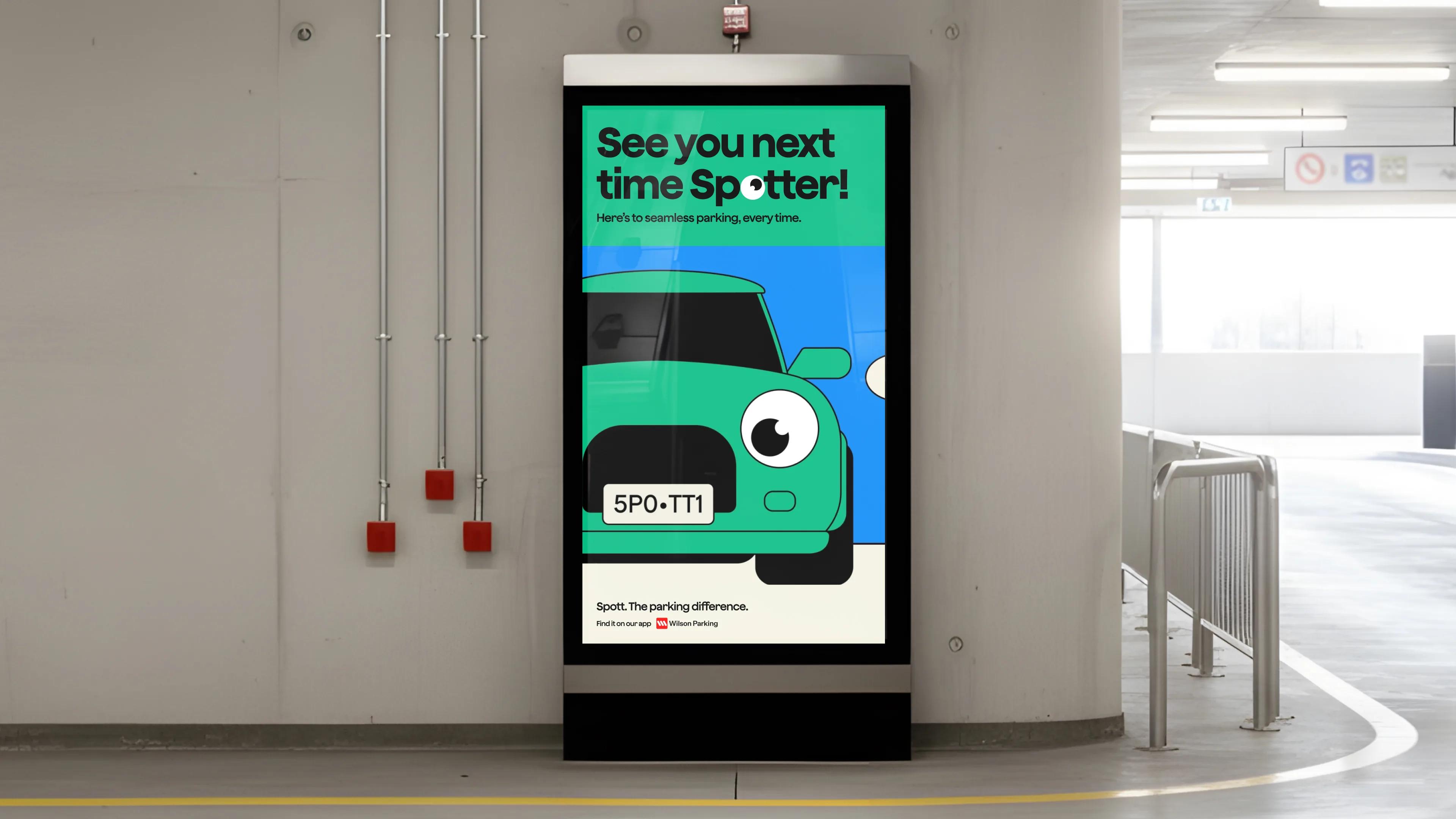 Digital screen in a car park showing a green cartoon car and 'See you next time Spotter!'