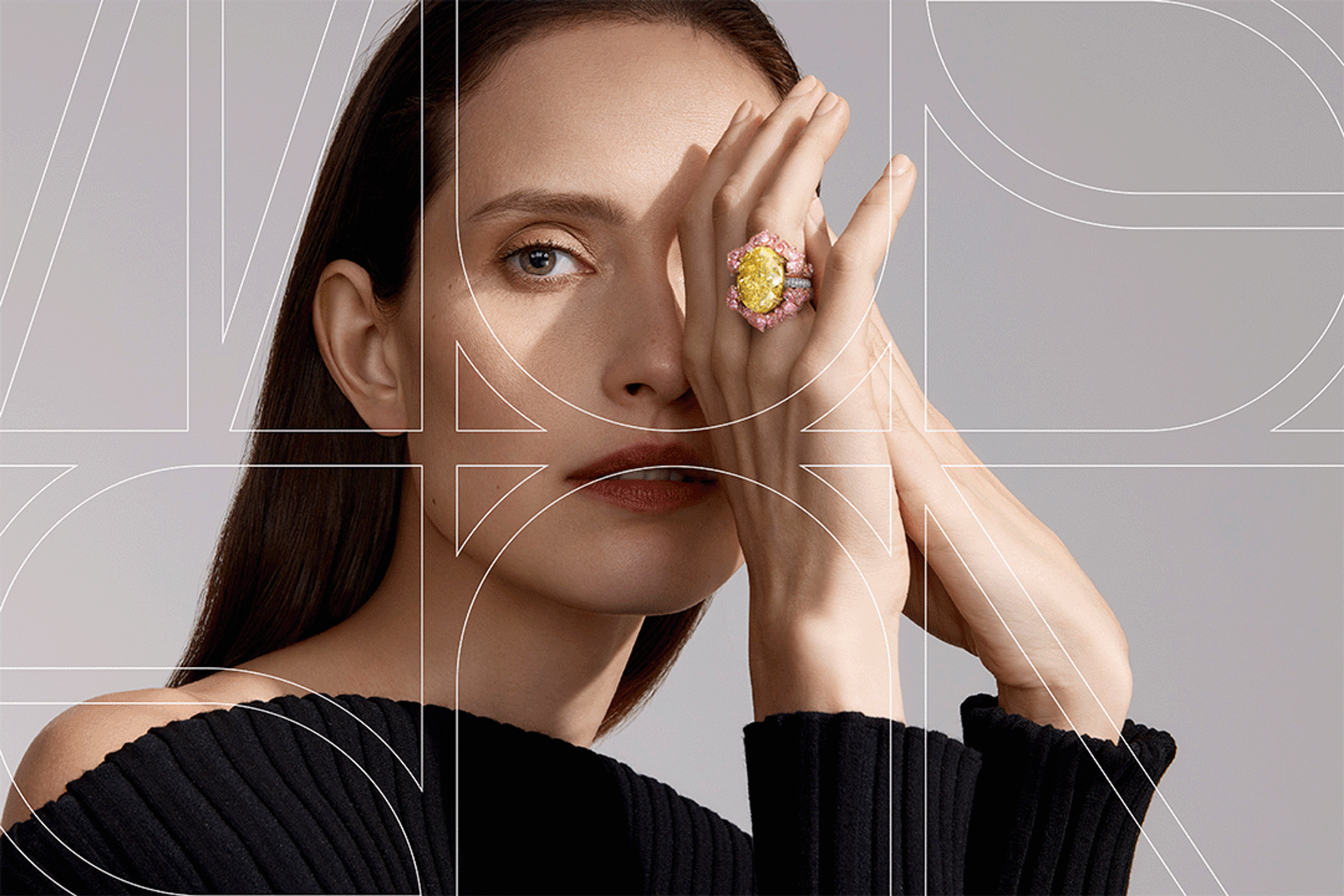 Musson campaign portrait: model shielding one eye, yellow diamond ring, monogram line overlay