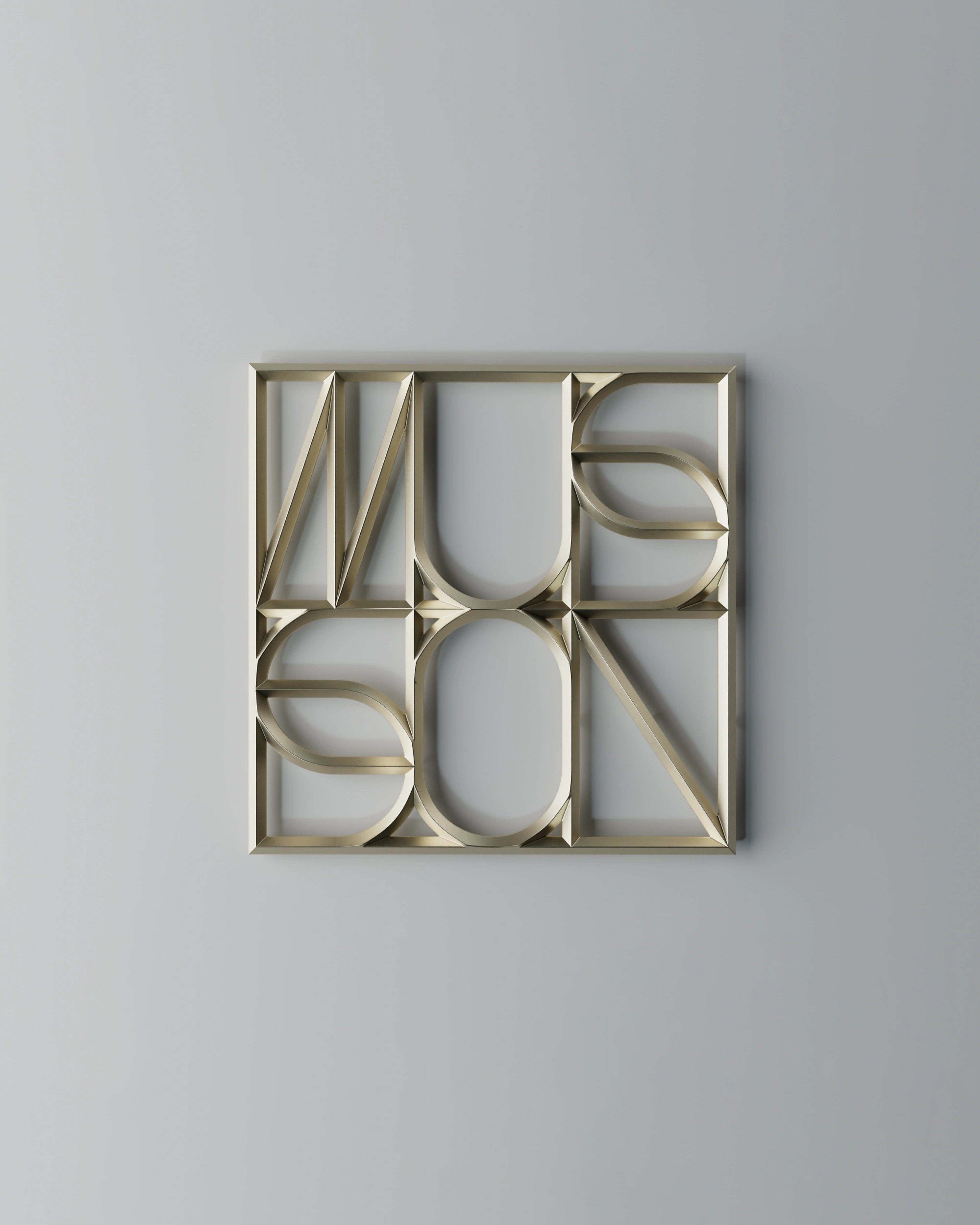 Musson monogram as a square brass wall plaque, its letters interlocked in a four-part grid