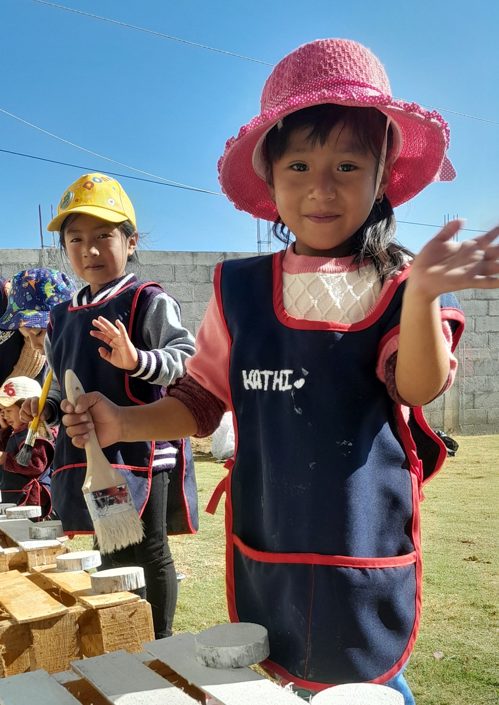 An open-air classroom in rural Guatemala, a facilitator teaching at the board