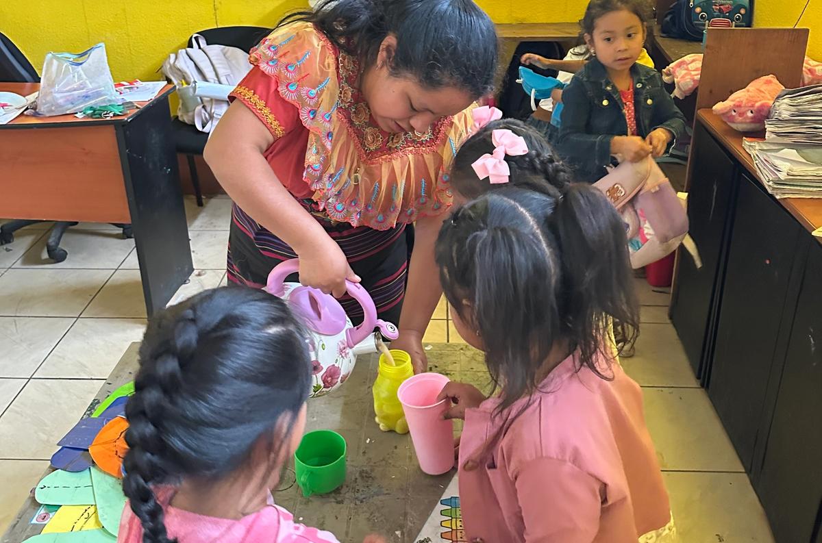 A young girl holding Chispuditos supplement.