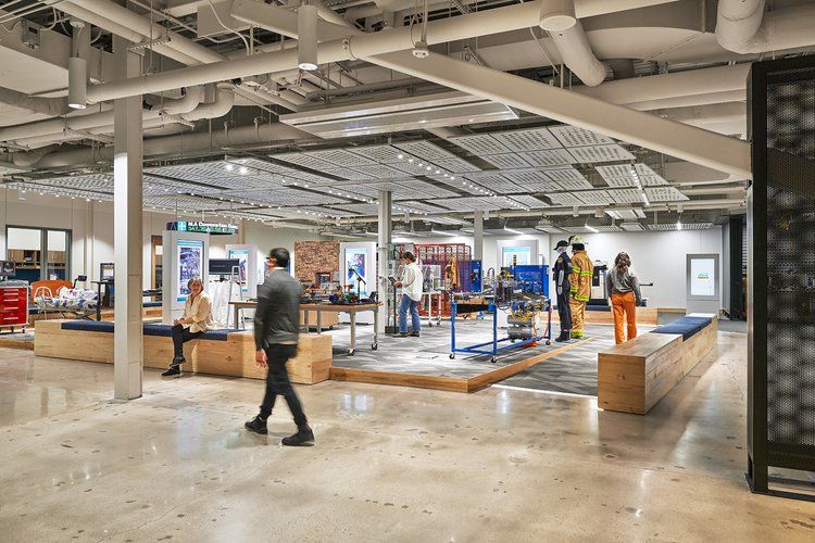 People walking in Make-It Center interior space