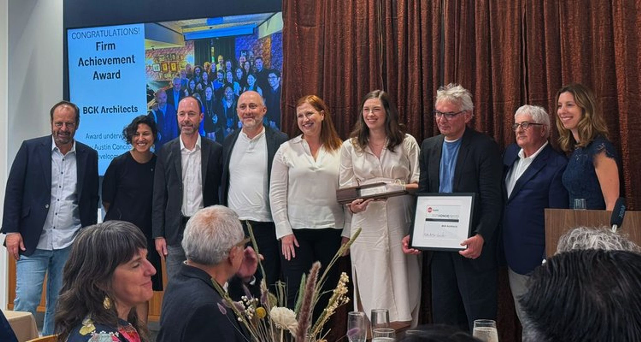 BGK staff on stage receiving award