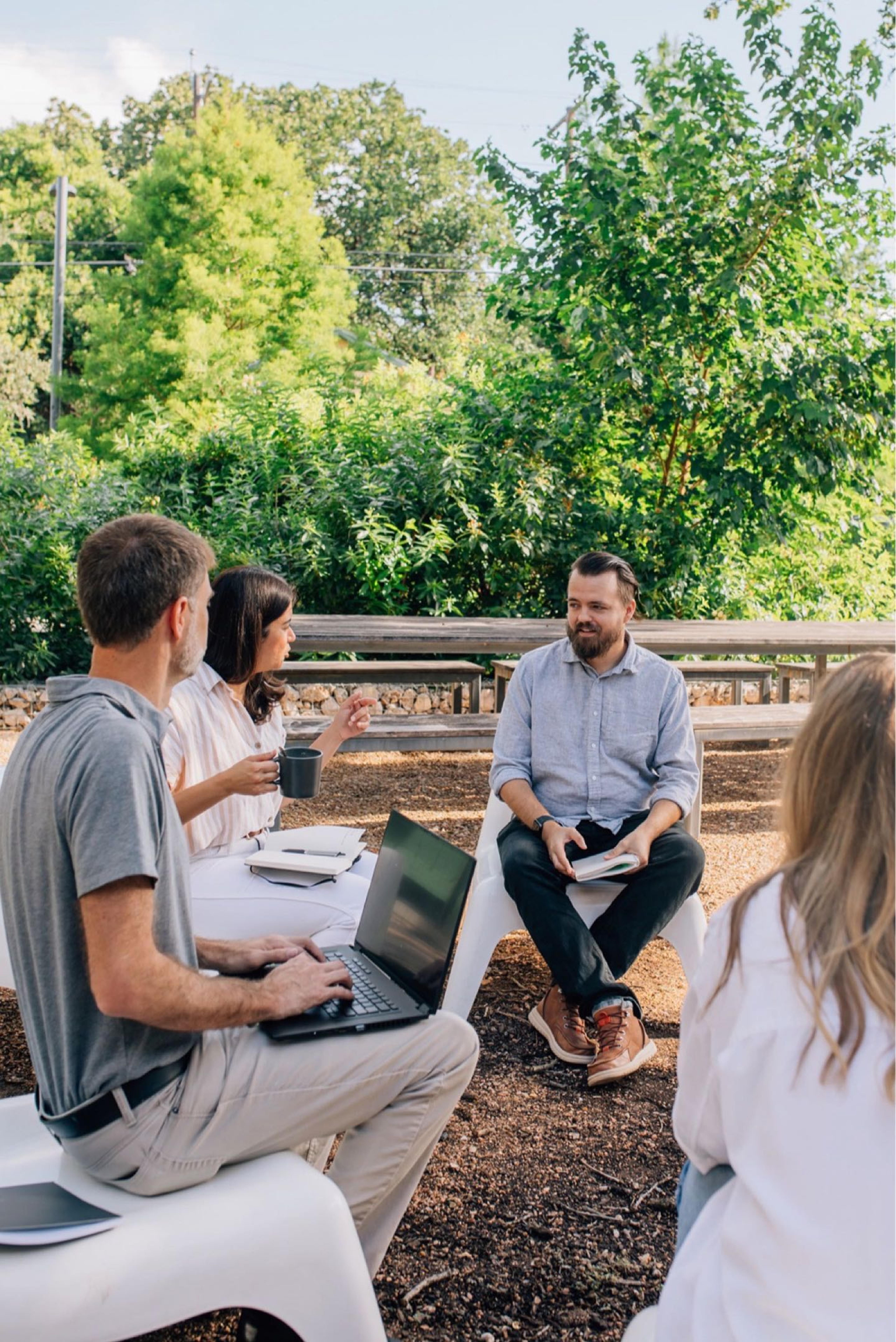 people in meeting outdoors