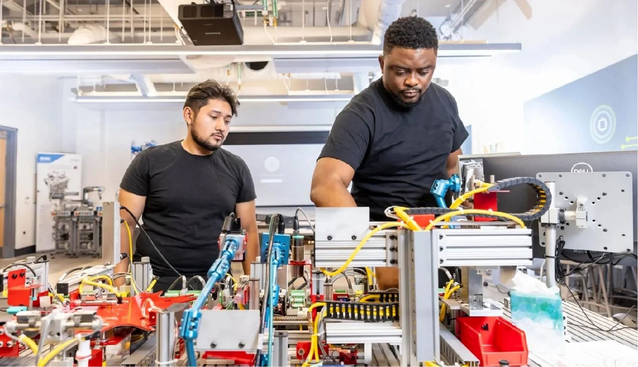 2 men working in a factory