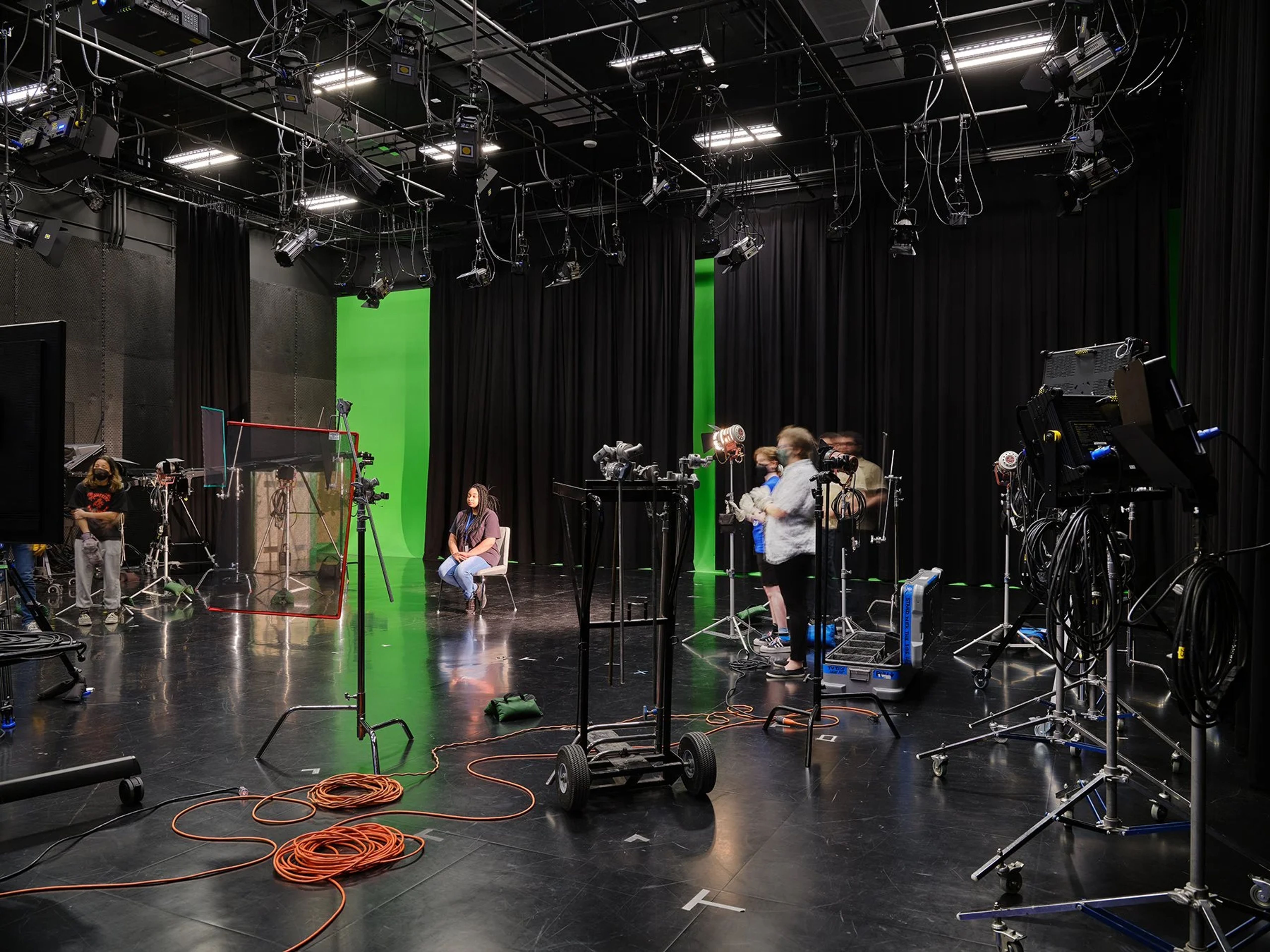 person sitting in media studio