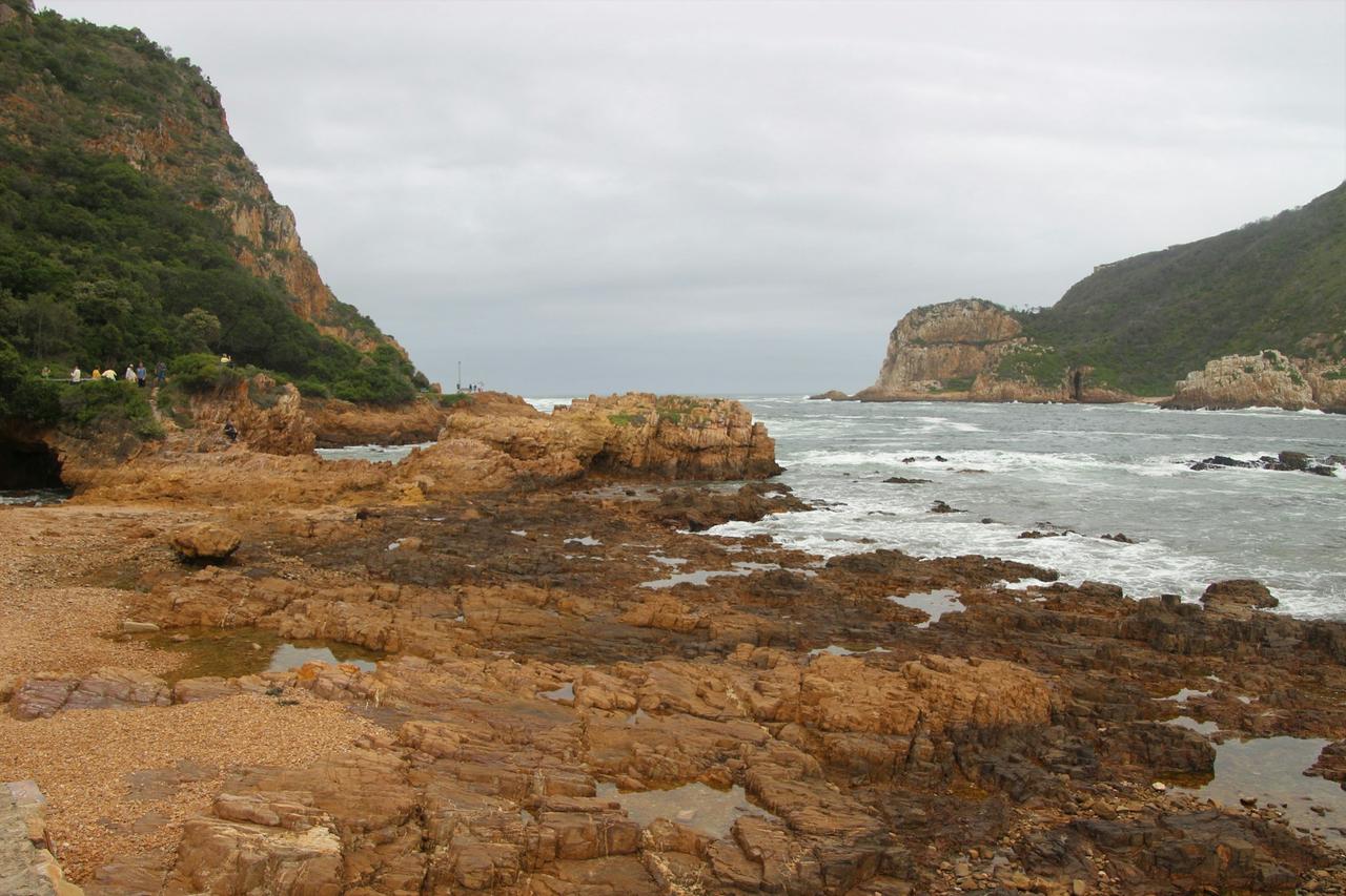 Sandstone rocks and tidal pools at the Knysna Heads, where the lagoon meets the Indian Ocean