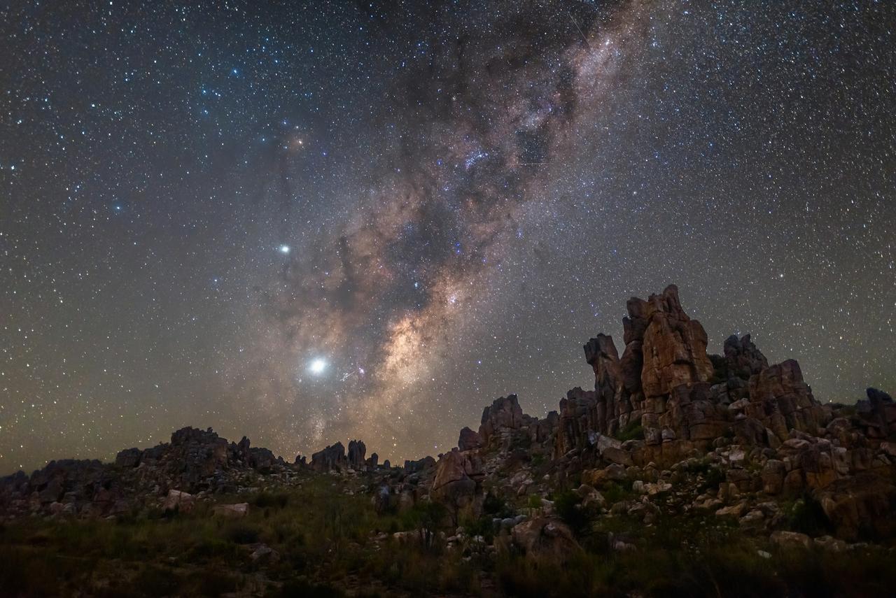 The Milky Way over sandstone rock formations in the Cederberg at night