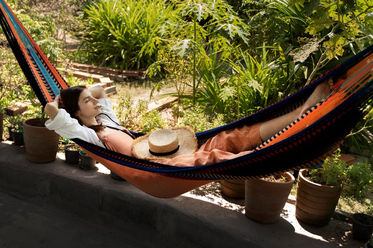 Woman relaxing in a hammock
