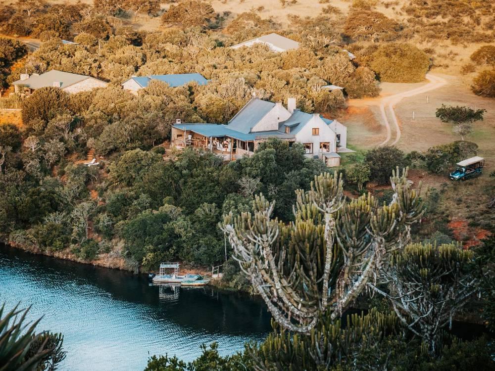 African Safari Lodge in the bush above the Kariega River near Makhanda, with euphorbia trees in the foreground