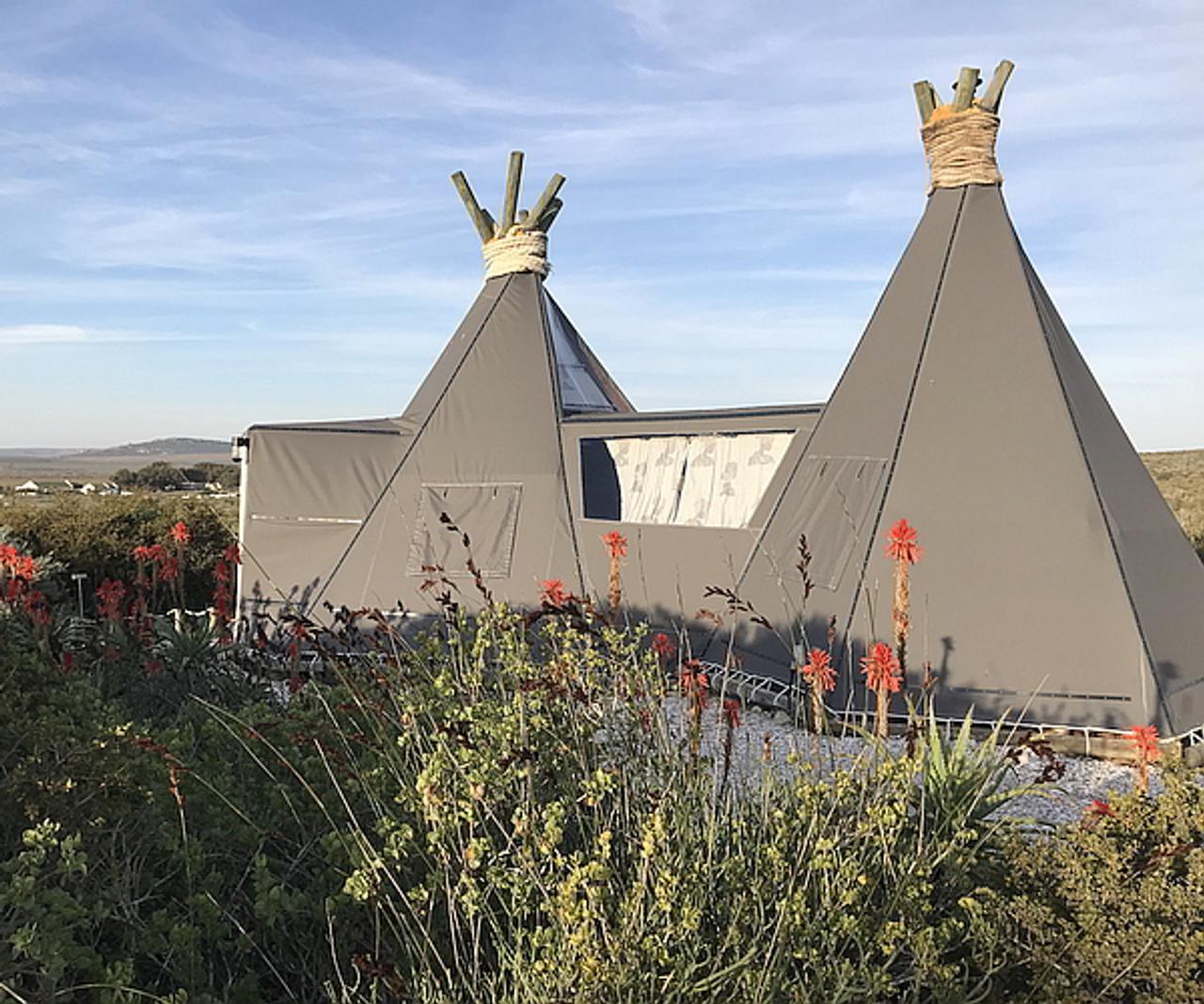 Tipi-style tent among fynbos and red aloes at Farr Out Guesthouse in Paternoster