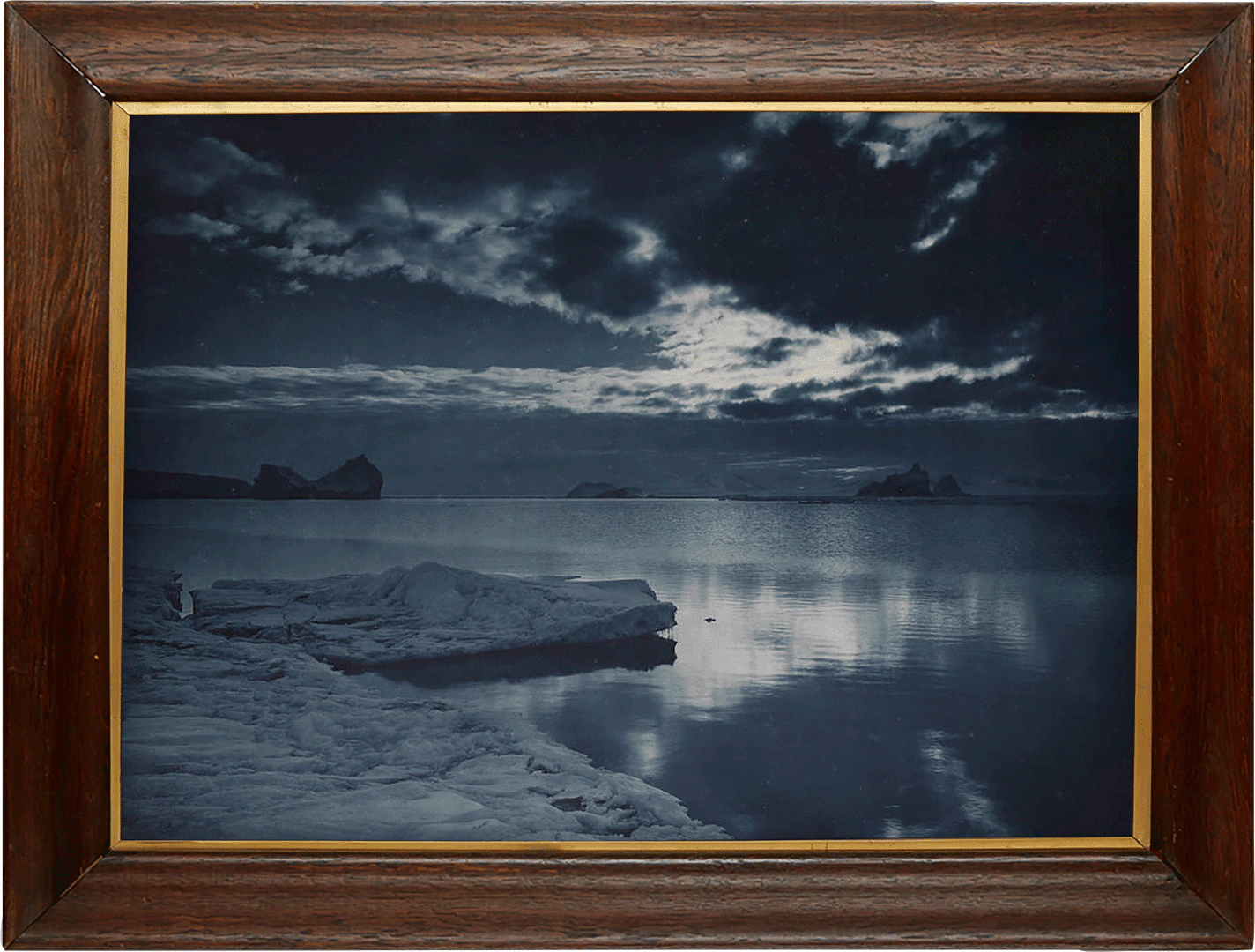 A c-print by Herbert Ponting, titled, Midnight in the Antarctic Summer, dated 1911.