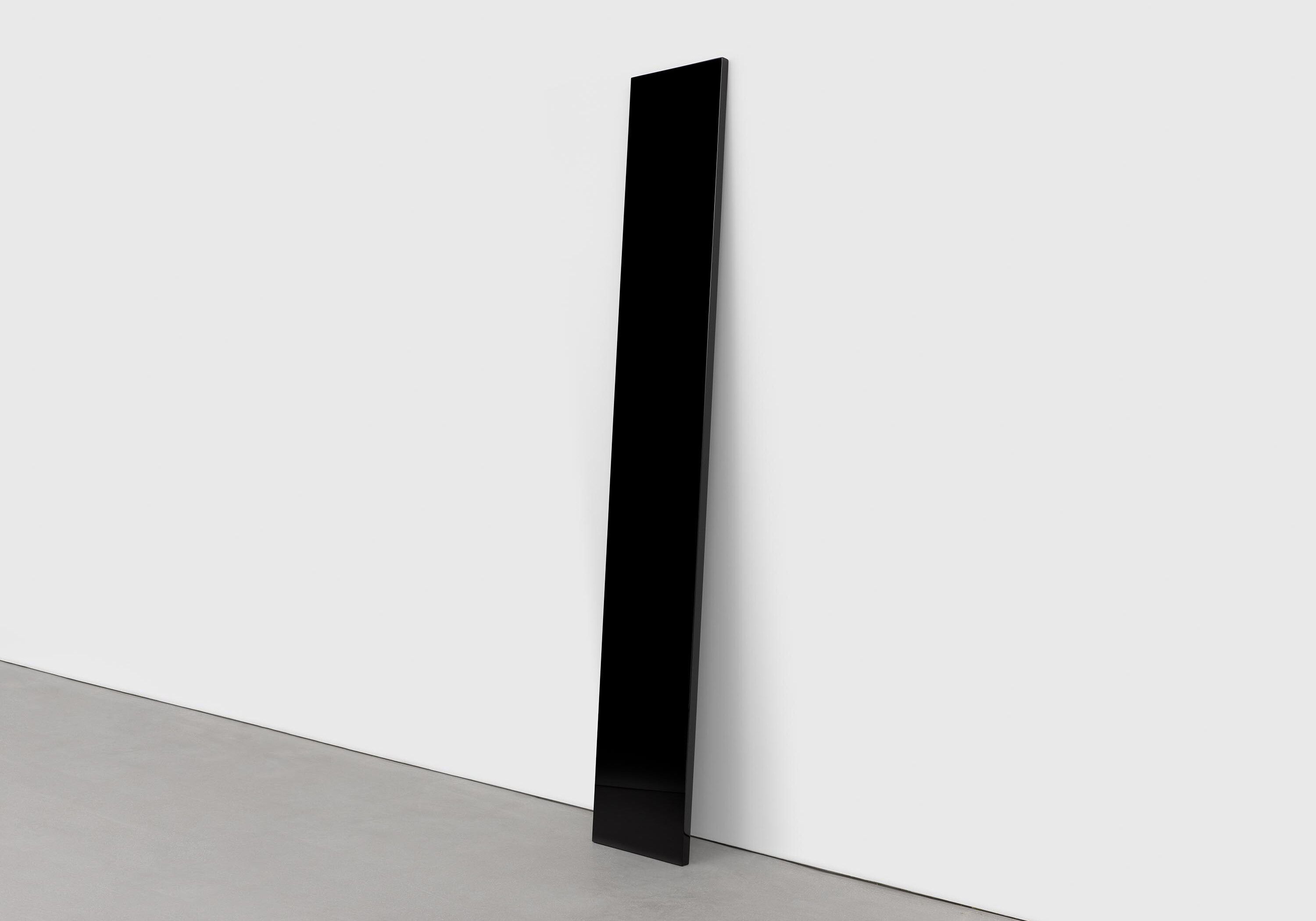 A sculpture by John McCracken, titled Black Plank, dated 1988.