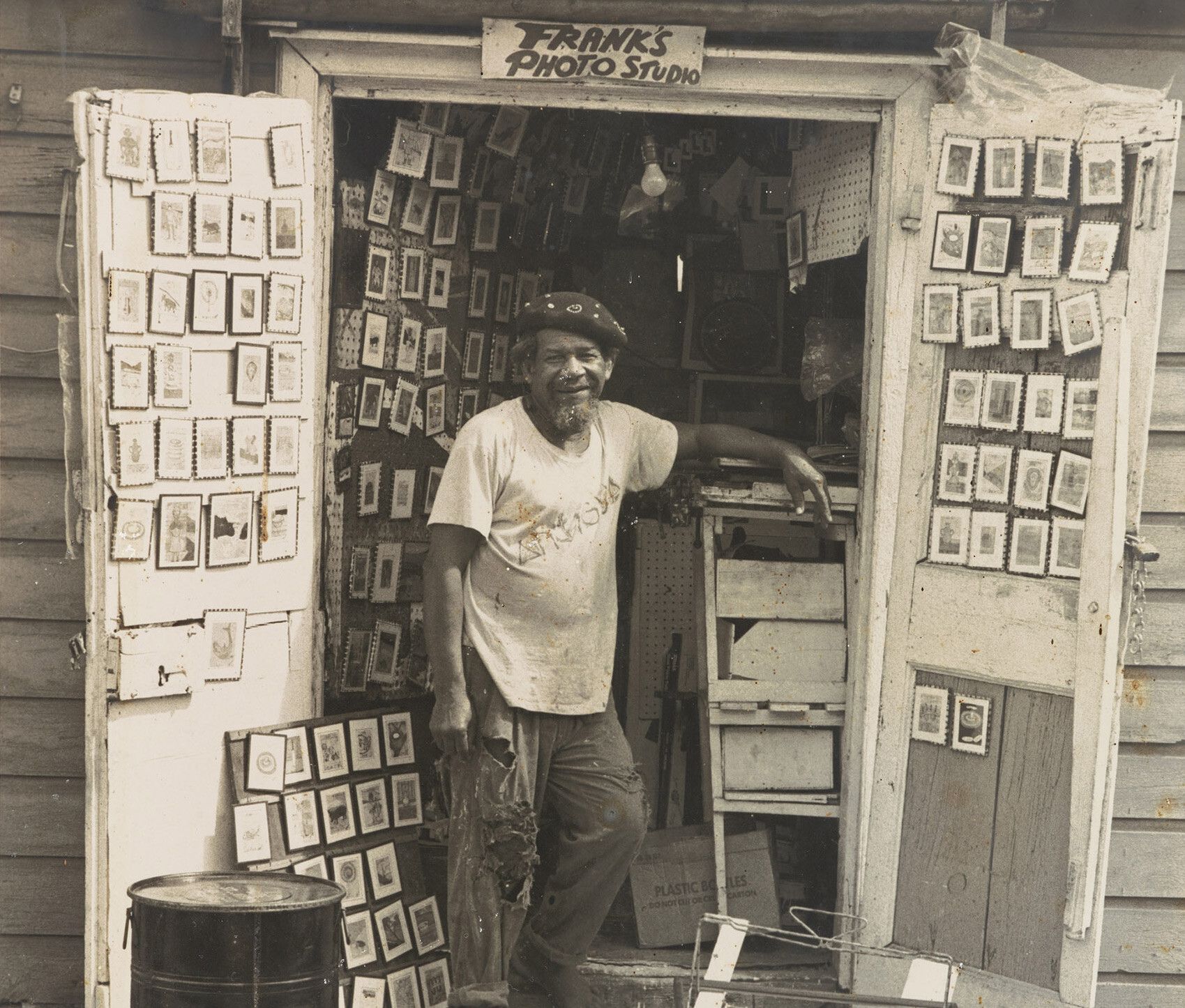 A portrait of frank Walter outside his photo studio in Antigua.
