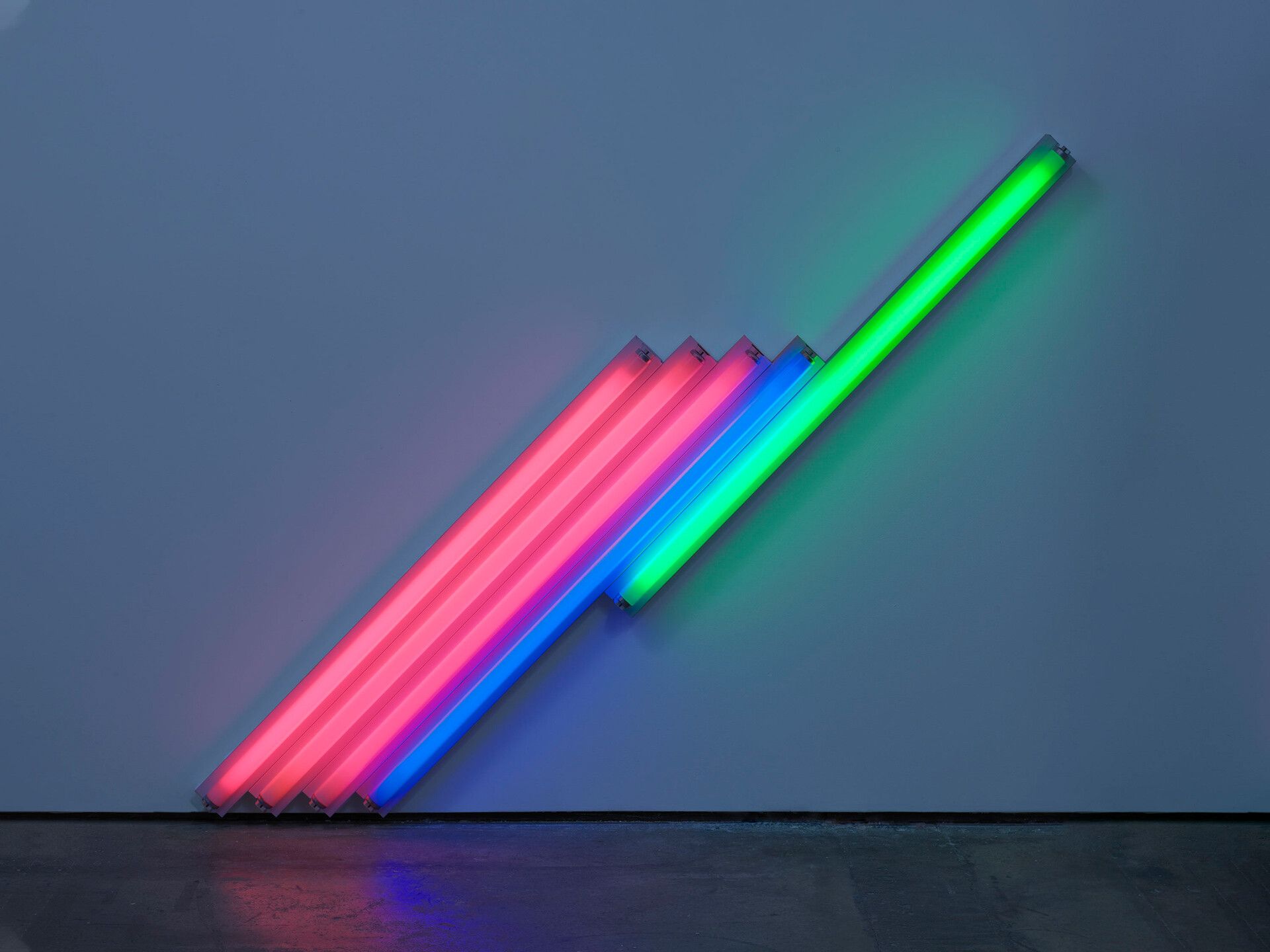 A pink, blue, and green fluorescent light sculpture by Dan Flavin, titled untitled (for Frederika and Ian) 4, dated 1987.