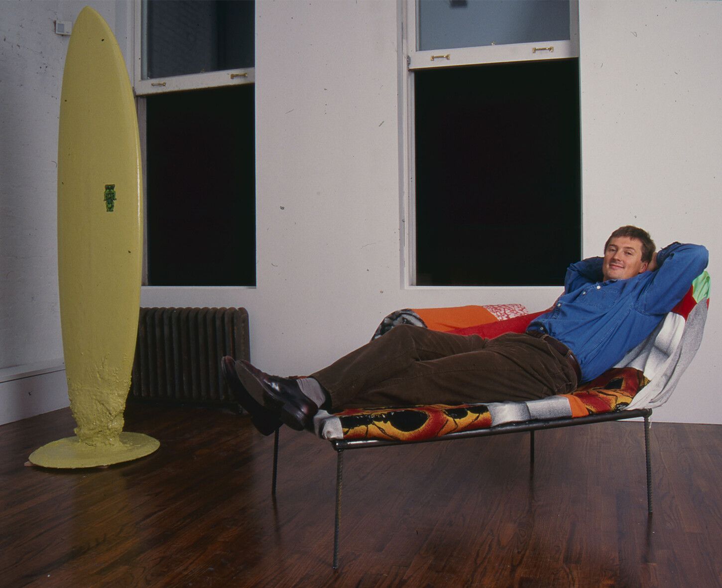A photograph of David Zwirner on Franz West’s Limerick, dated 1994