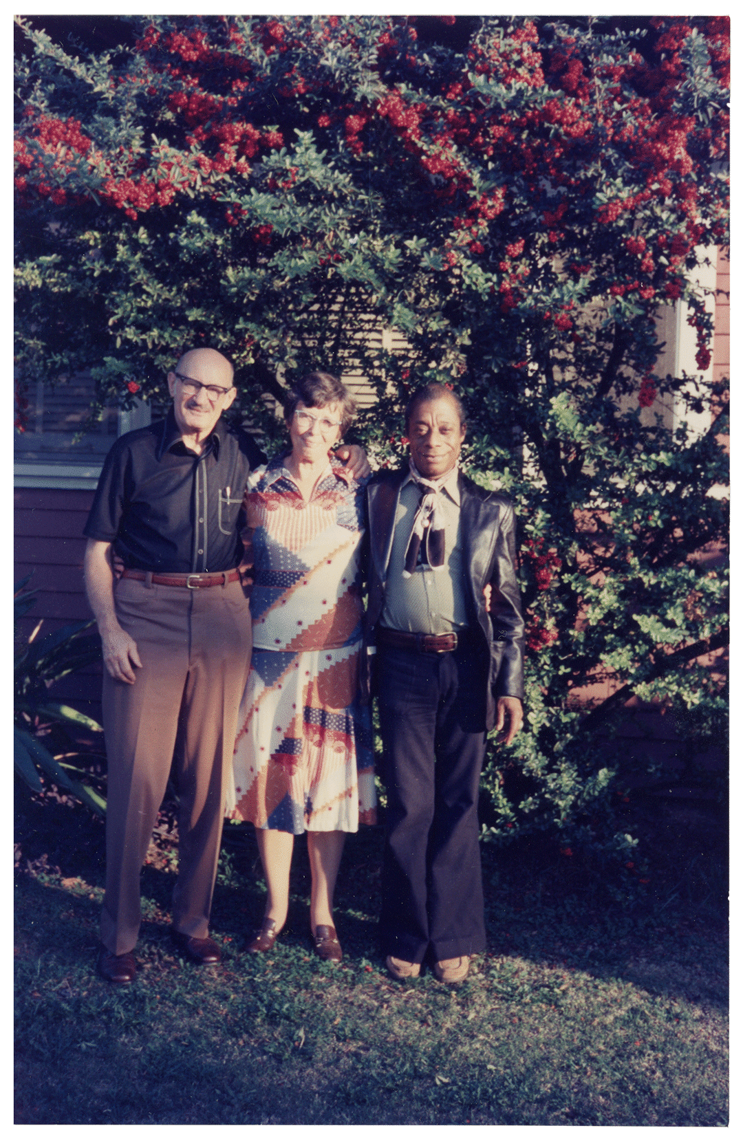 A photograph of Evan and Orilla "Bill" Winfield with James Baldwin in Los Angeles, dated November 1976.