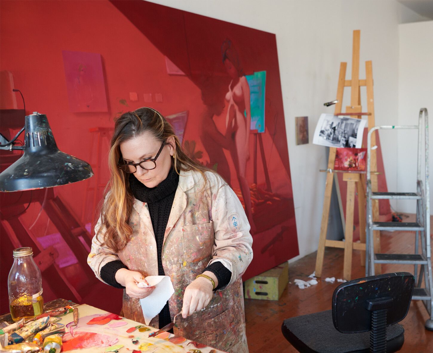 A  Photo by Jason Schmidt of Lisa Yuskavage in her studio, dated 2020.