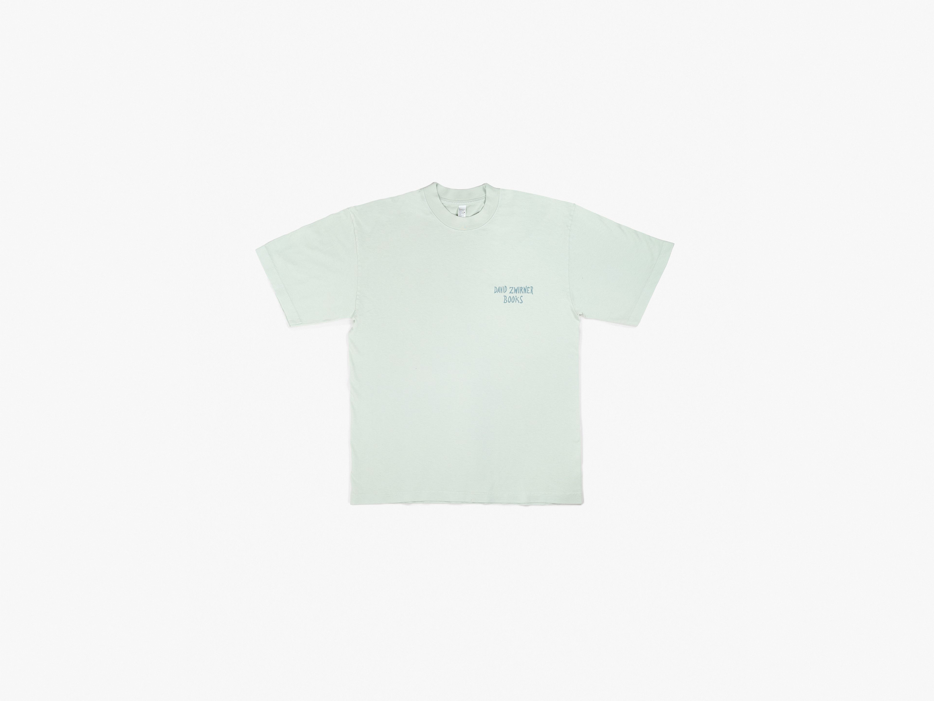 A relaxed, garment-dyed tee in seafoam green, featuring screenprinted handwriting by Marcel Dzama.