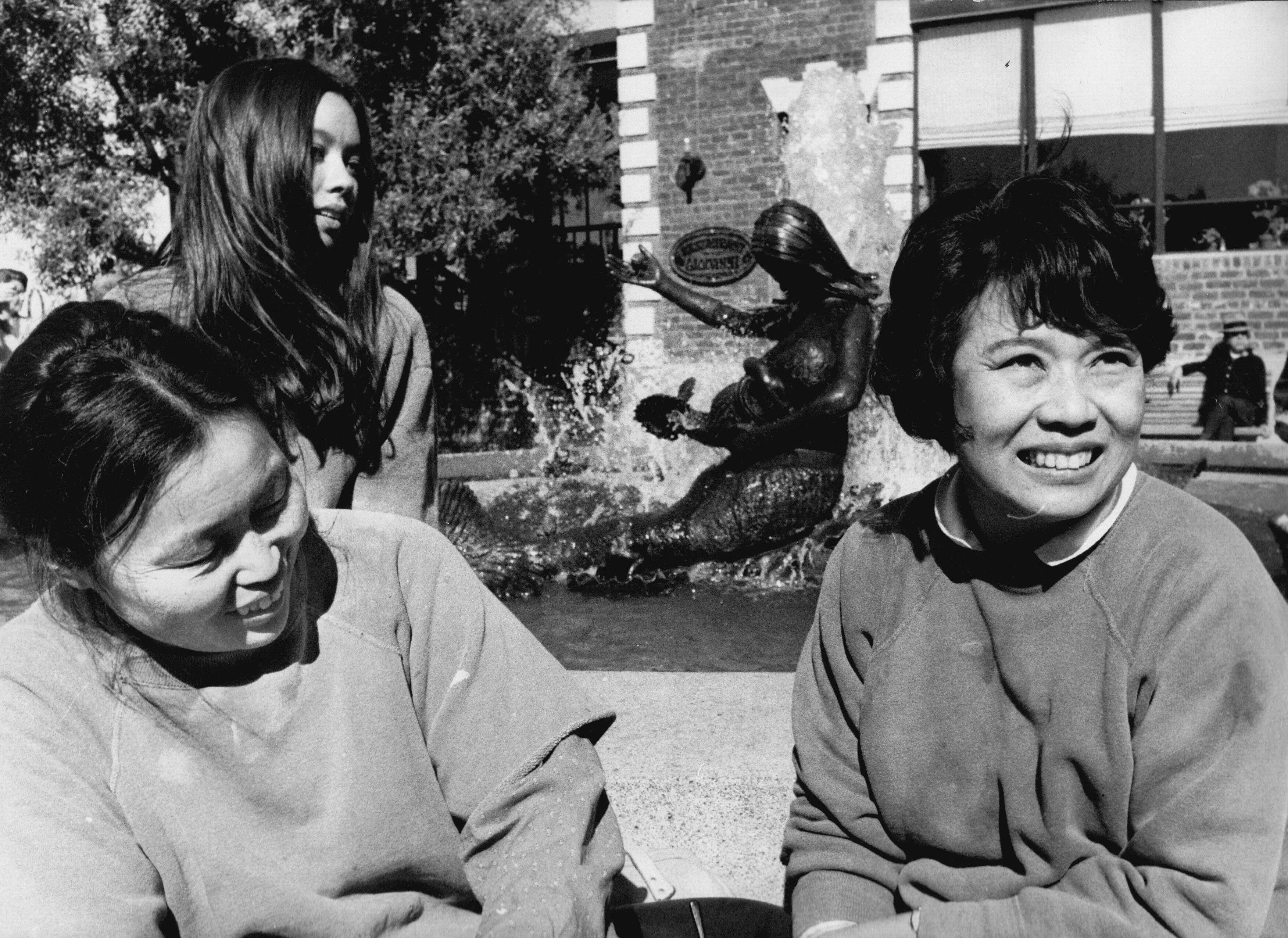 Asawa with daughter Aiko and assistant Mae Lum Lee at Andrea, her fountain in Ghirardelli Square, San Francisco, dated 1968