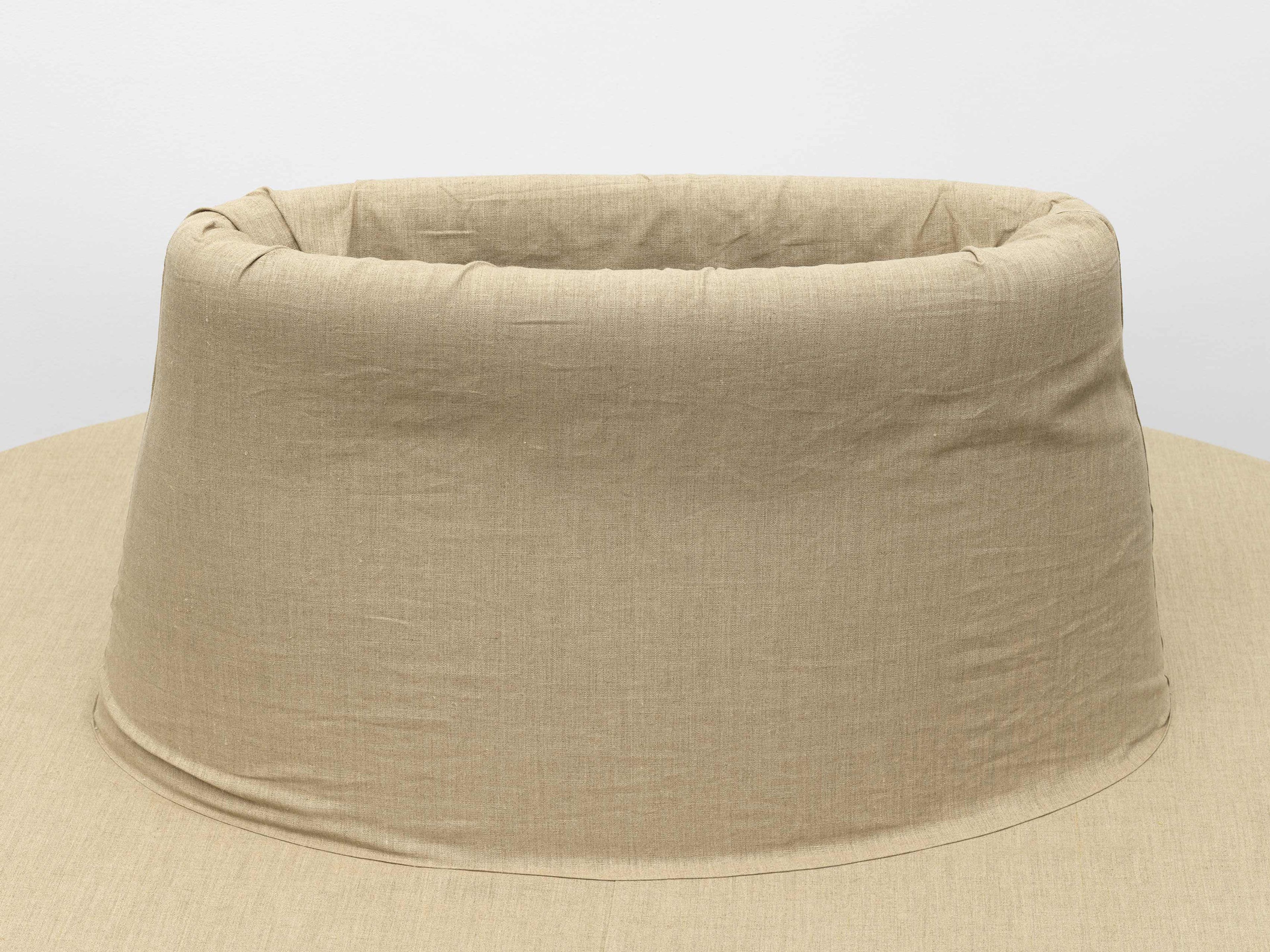 A piece of furniture by Franz West, titled Pouf, dated 2000.