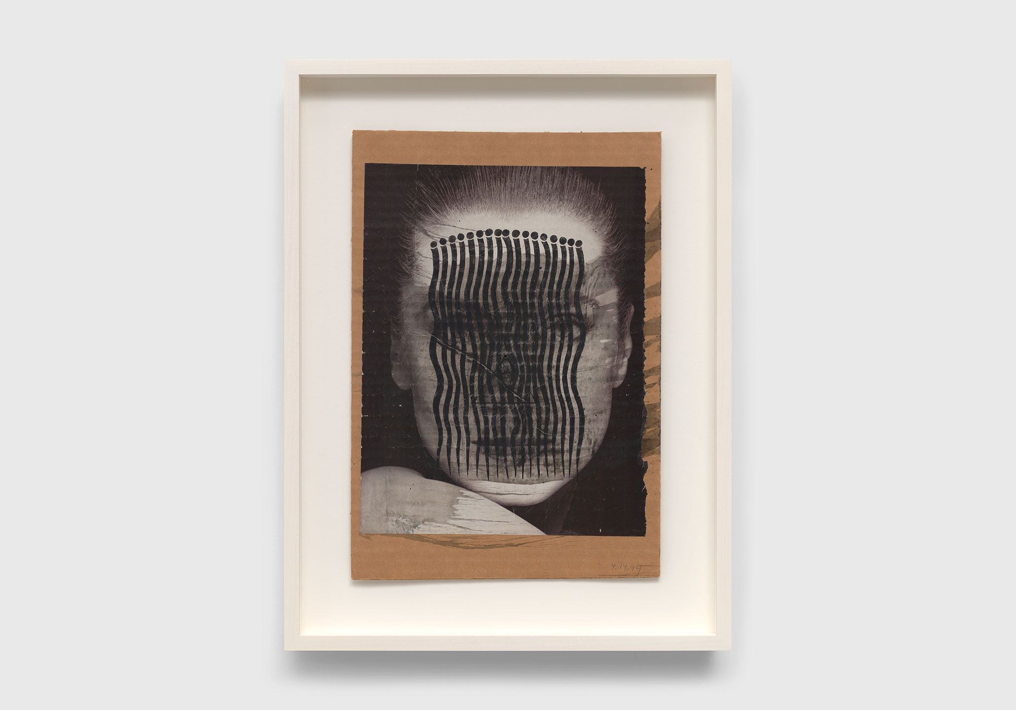 A collage on corrugated cardboard by Ray Johnson, titled Untitled (Catherine Deneuve with Bridget Riley’s Comb), dated 1994.