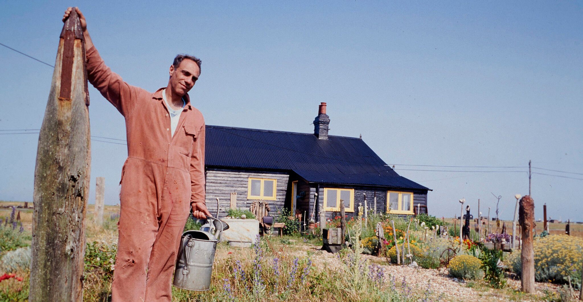 A photo of Derek Jarman at Prospect Cottage in 1991. Photo by Geraint Lewis.
