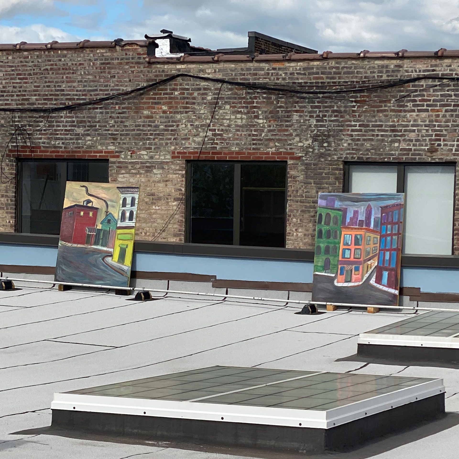 An installation view of the exhibition titled Josh Smith: High As Fuck on the artist's studio roof in Brooklyn, New York, dated 2020.