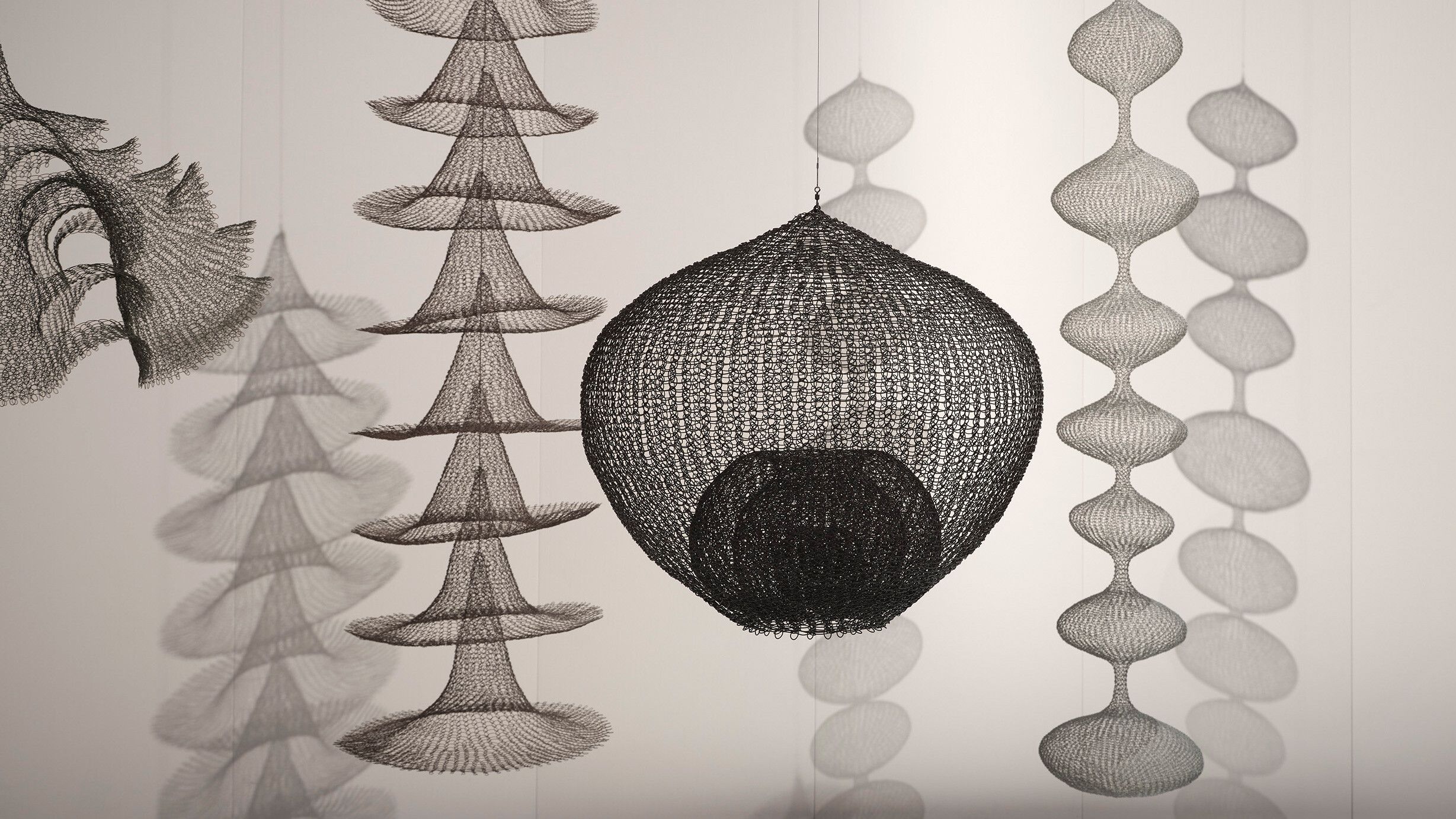 A horizontal installation view of Ruth Asawa's sculpture works at the 59th International Art Exhibition of La Biennale di Venezia titled The Milk of Dreams, curated by Cecilia Alemani in 2022